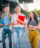 Friends walking with books in hand