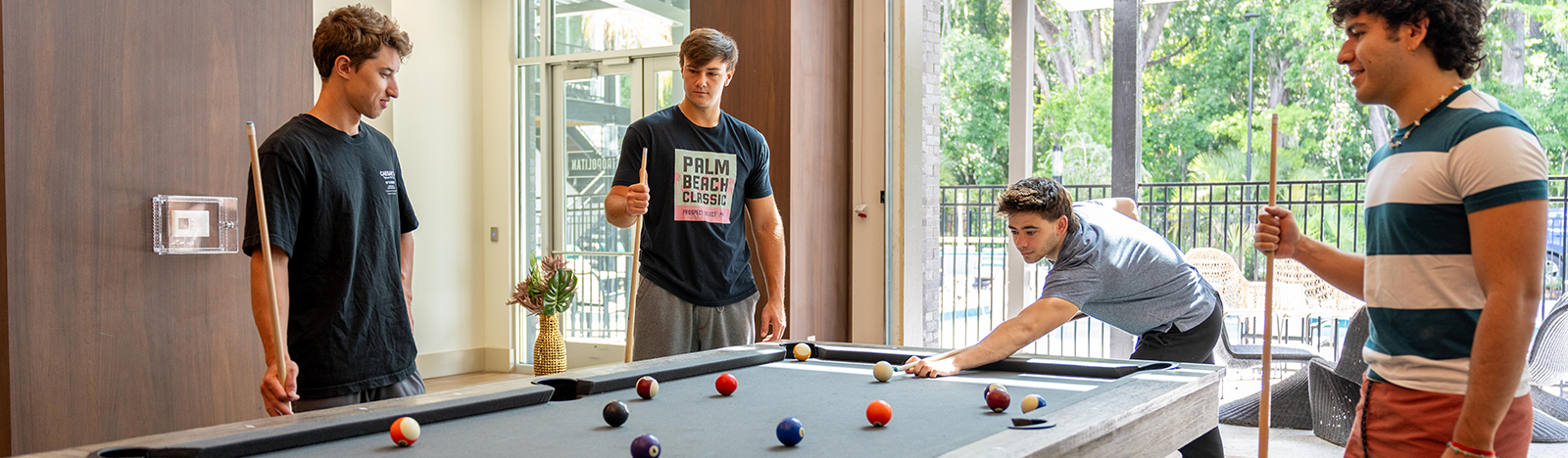 group of friends playing pool