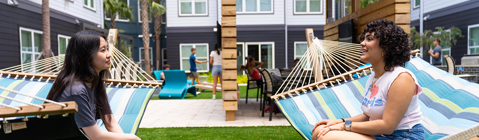 two girl hanging out on hammocks