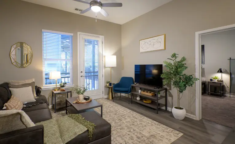 a furnished student apartment living room with a TV