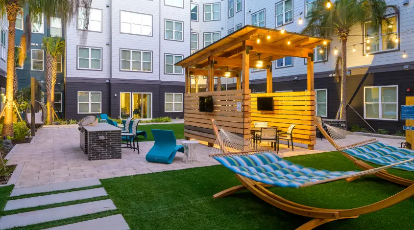 outdoor lounge area with hammocks and seating