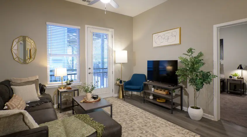 a furnished student apartment living room with a TV