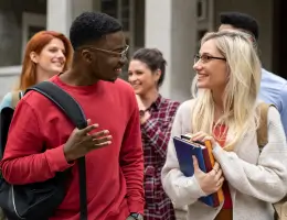 two students talking outside